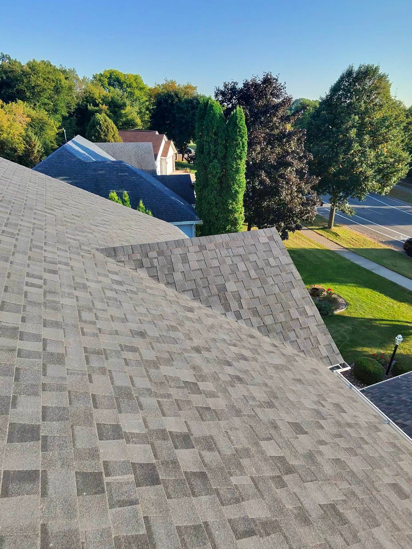 reroof_sun_vault_roofing_Madison_wi_east_side_moire_black_sunset_asphalt_shingle_20250922_close%20%281%29.jpg